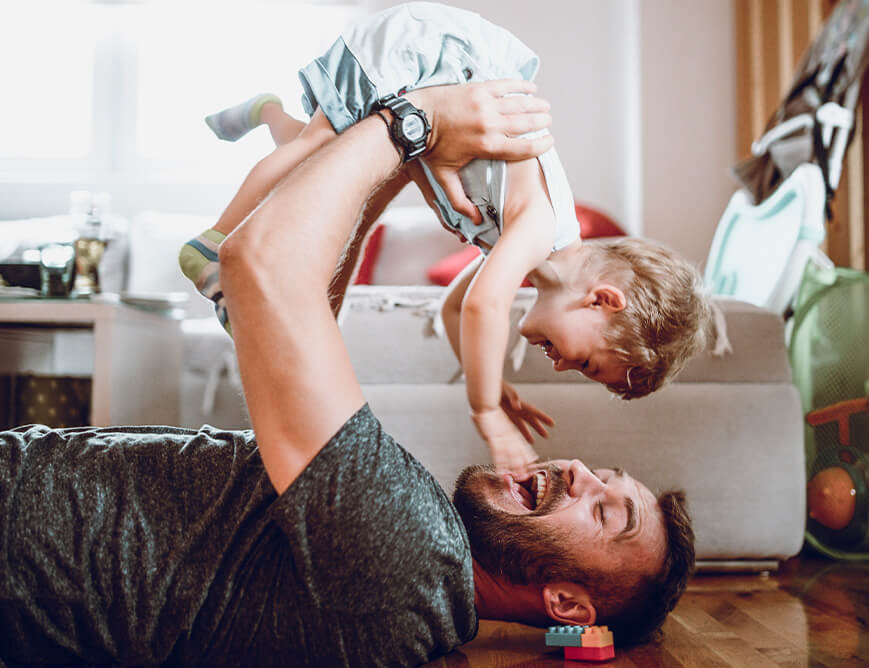 father playing with his young son