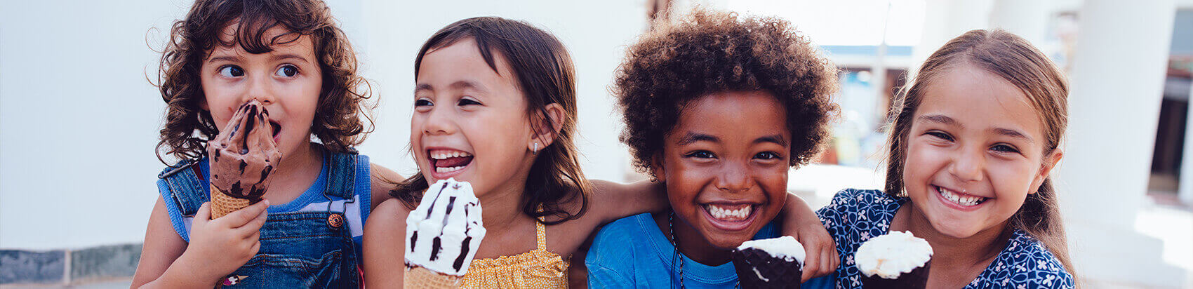 group of children eating ice cream together
