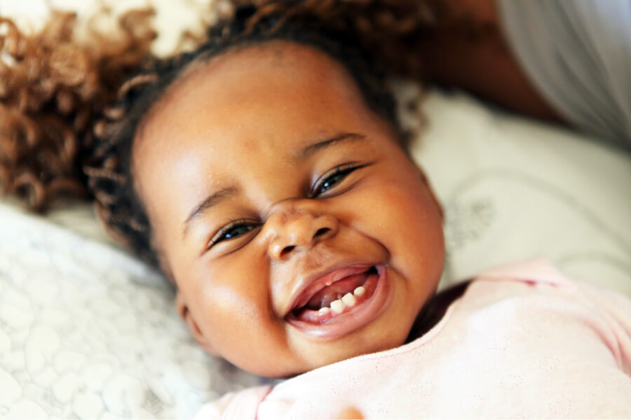 Closeup of a baby girl shortly after her first dental visit