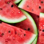 Aerial view of cut red and green watermelon with black seeds as a tooth-healthy summer treat
