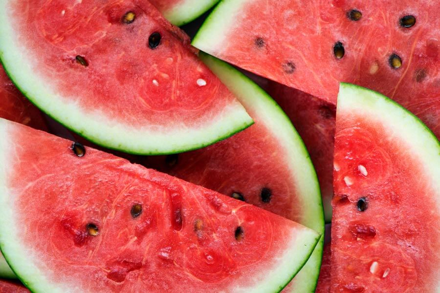 Aerial view of cut red and green watermelon with black seeds as a tooth-healthy summer treat