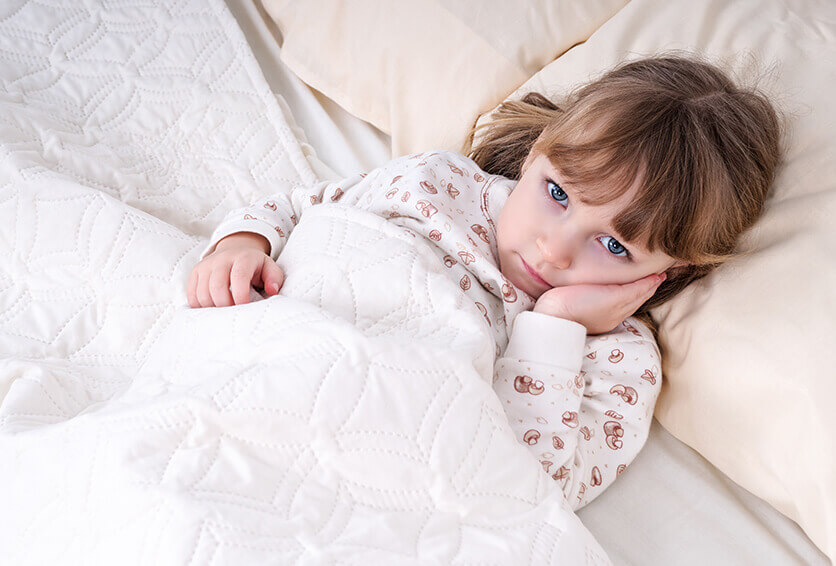 little girl holding her jaw