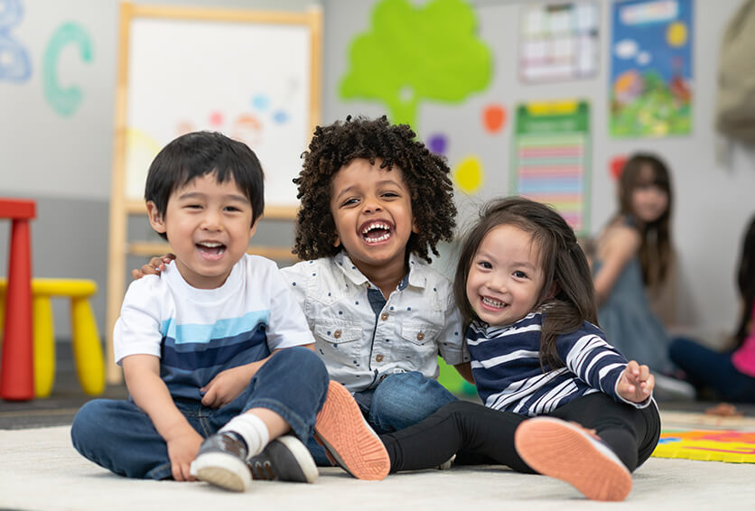 three young children playing together